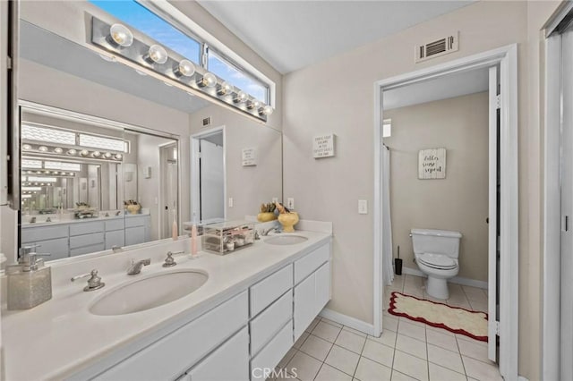 full bath with double vanity, visible vents, a sink, and tile patterned floors