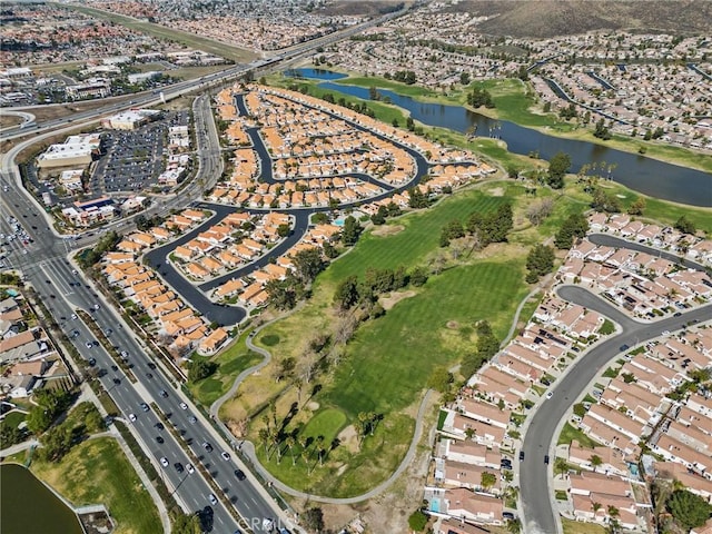 birds eye view of property featuring a water view and a residential view