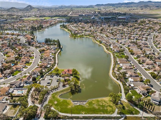 bird's eye view with a residential view and a water and mountain view