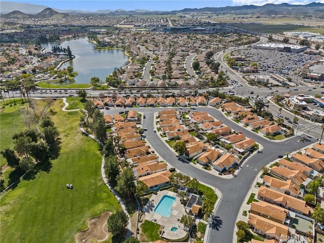 bird's eye view with a residential view and a water and mountain view