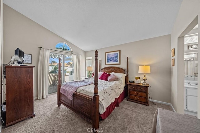 carpeted bedroom featuring access to exterior, baseboards, vaulted ceiling, and ensuite bath