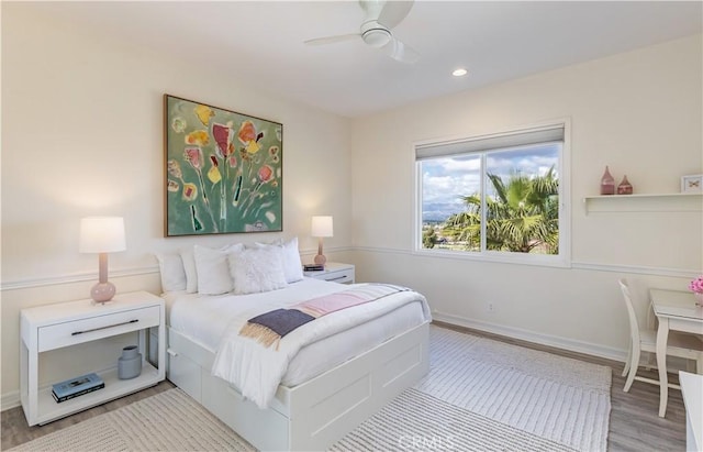 bedroom with baseboards, ceiling fan, wood finished floors, and recessed lighting