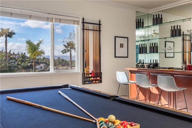 rec room with ornamental molding, pool table, and bar