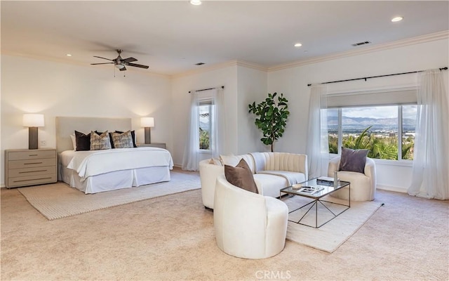 carpeted bedroom featuring multiple windows, recessed lighting, visible vents, and crown molding