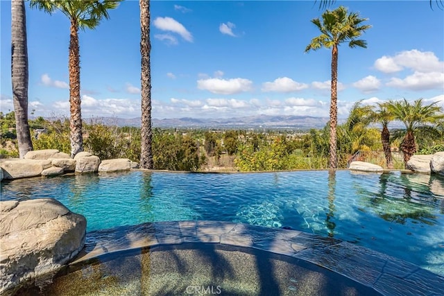 view of pool featuring an infinity pool