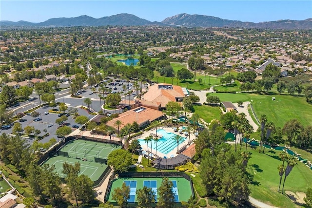 bird's eye view featuring a residential view, a mountain view, and view of golf course