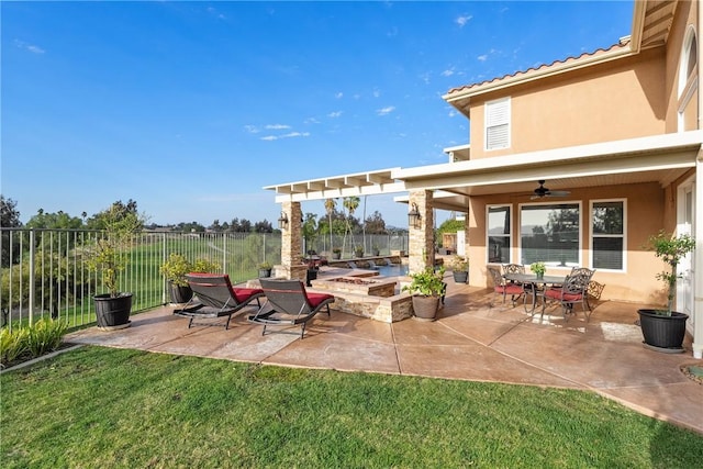 view of patio / terrace featuring a fire pit, a ceiling fan, and fence