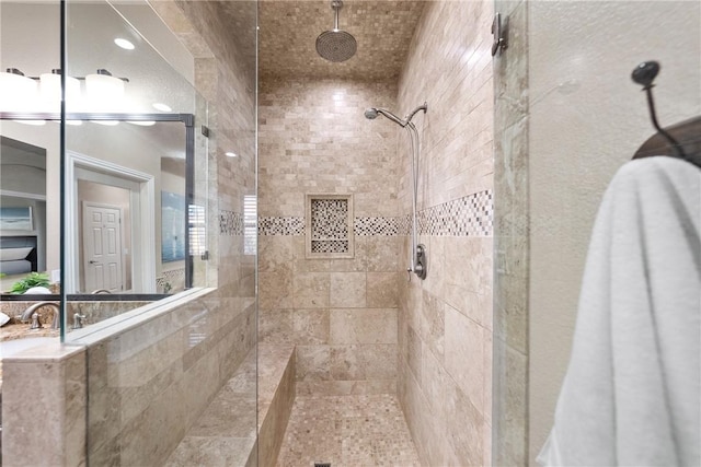 full bath featuring tiled shower