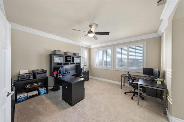 carpeted office space featuring visible vents, ceiling fan, crown molding, and baseboards