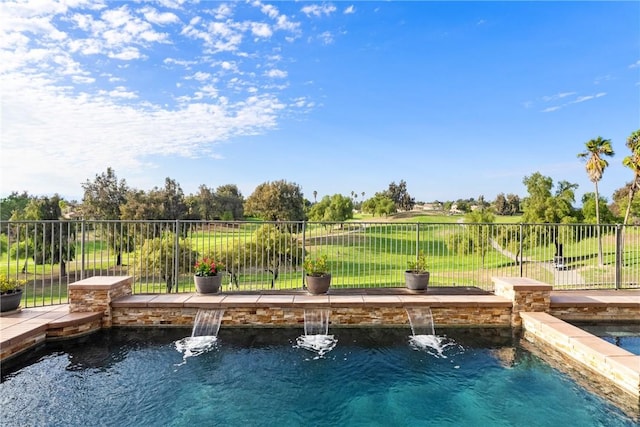 view of swimming pool featuring a fenced in pool and fence