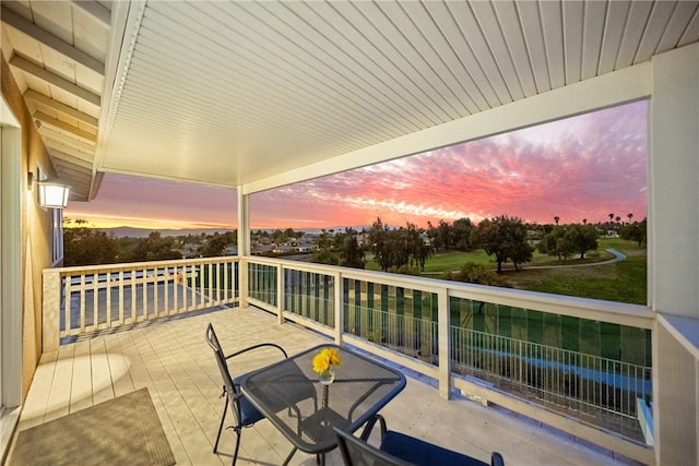 view of balcony at dusk