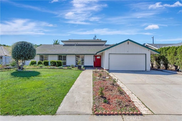 view of front facade with a garage, driveway, and a front lawn