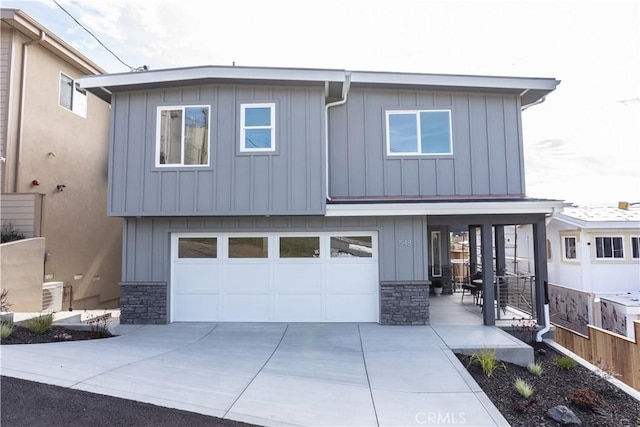 view of front of home featuring stone siding and board and batten siding