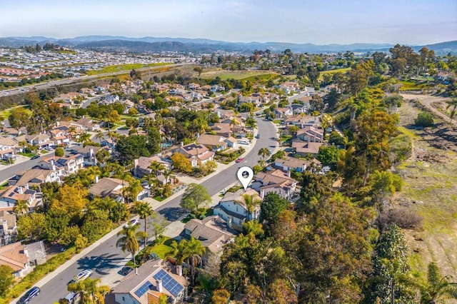 birds eye view of property with a residential view and a mountain view