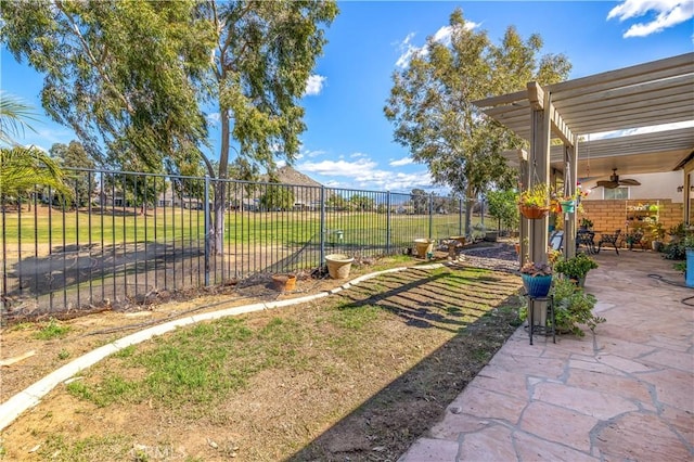 view of yard with fence, a pergola, and a patio