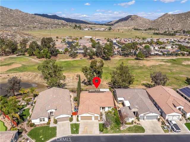 birds eye view of property with a residential view and a mountain view