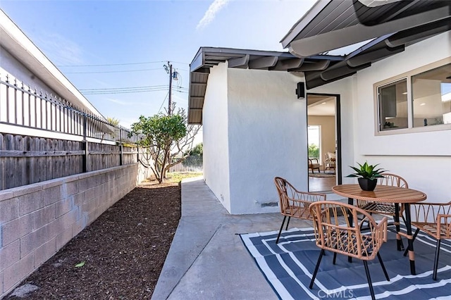 view of patio / terrace with fence