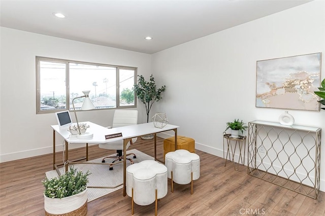 office featuring recessed lighting, baseboards, and wood finished floors