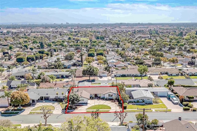 birds eye view of property with a residential view