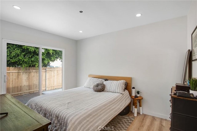 bedroom featuring recessed lighting, baseboards, access to exterior, and wood finished floors
