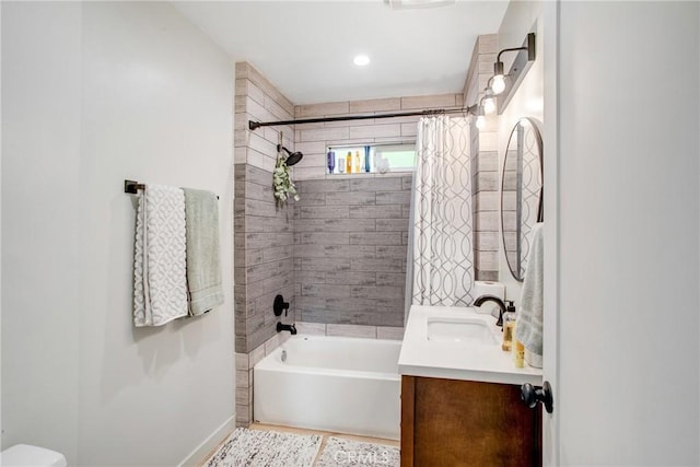 full bathroom featuring vanity, baseboards, toilet, and shower / bath combination with curtain