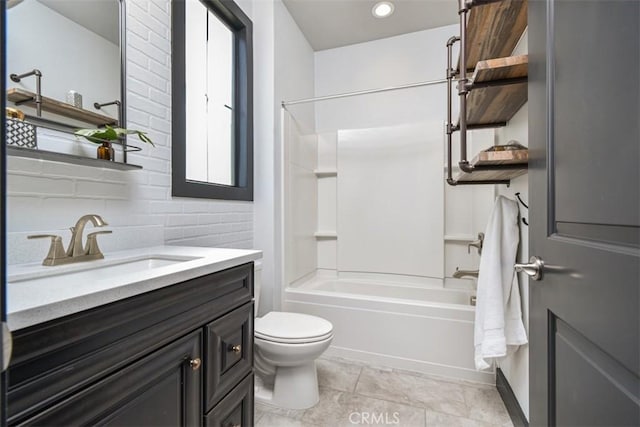 bathroom with tile patterned flooring, shower / tub combination, vanity, and toilet