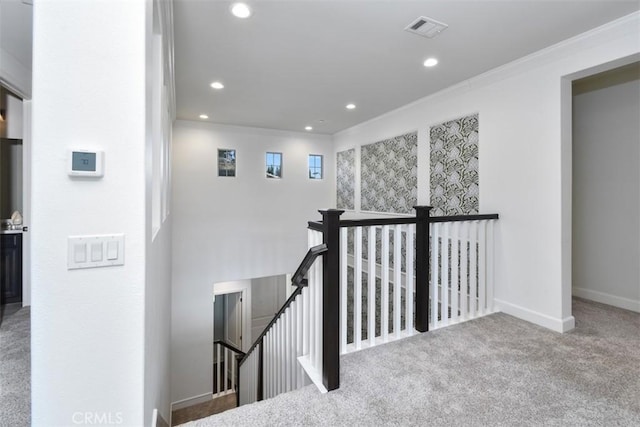 hallway featuring carpet floors, recessed lighting, visible vents, an upstairs landing, and baseboards