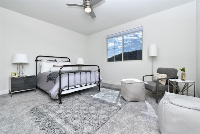 bedroom featuring a ceiling fan, carpet flooring, and baseboards