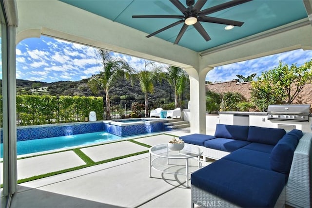 view of patio with an outdoor kitchen, ceiling fan, a fenced backyard, an outdoor hangout area, and a grill