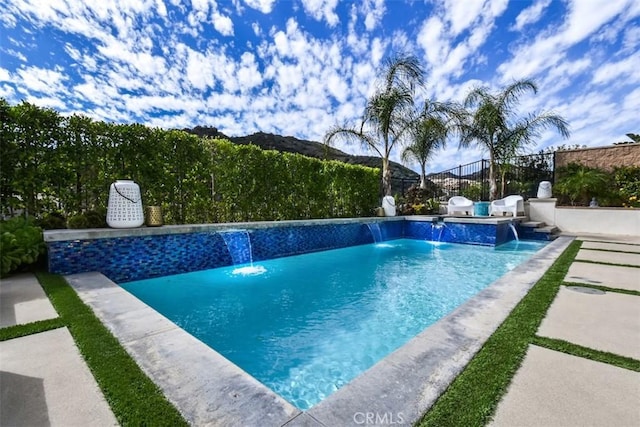 view of pool with a fenced in pool, a patio area, and fence