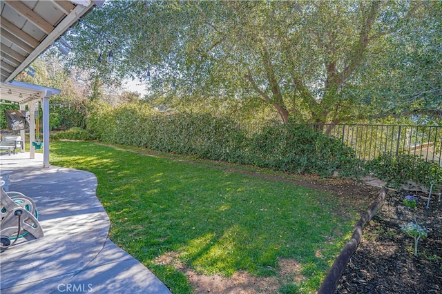 view of yard featuring a patio area and fence