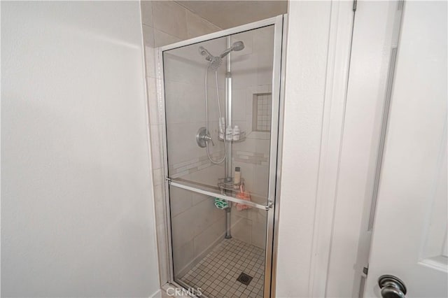 full bathroom with a shower stall