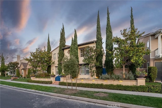 view of front of home featuring a residential view and stucco siding