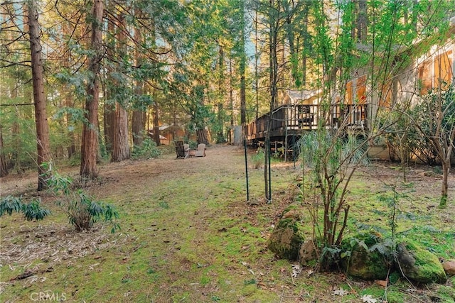 6356 Hidden Lake Ln, Magalia, CA 95954 - view of yard featuring a view of trees and a wooden deck