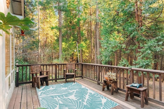 deck featuring a forest view