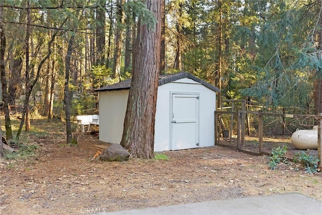 view of shed with fence