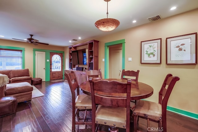 dining space featuring dark wood-style flooring, recessed lighting, visible vents, a ceiling fan, and baseboards