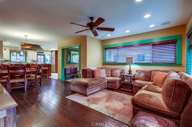 living area with recessed lighting, ceiling fan, and wood finished floors