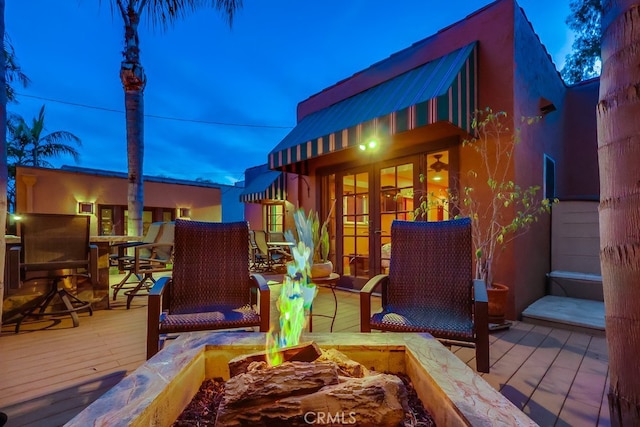 deck featuring an outdoor fire pit