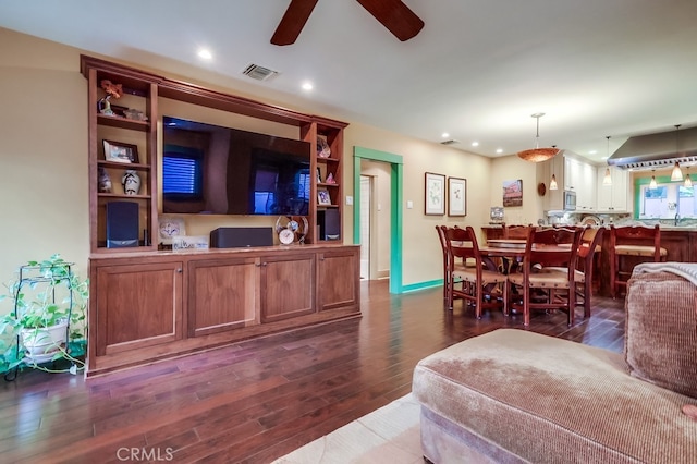 living area featuring dark wood-style floors, recessed lighting, visible vents, and ceiling fan