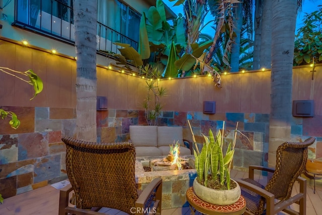 view of patio with an outdoor fire pit