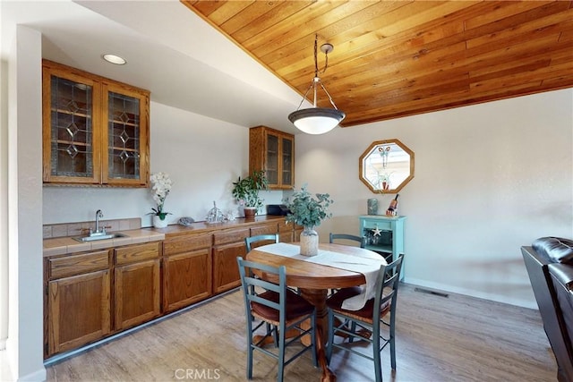 332 Grove St, Los Osos, CA 93402 - dining space featuring wooden ceiling, vaulted ceiling, light wood-style floors, recessed lighting, and bar area