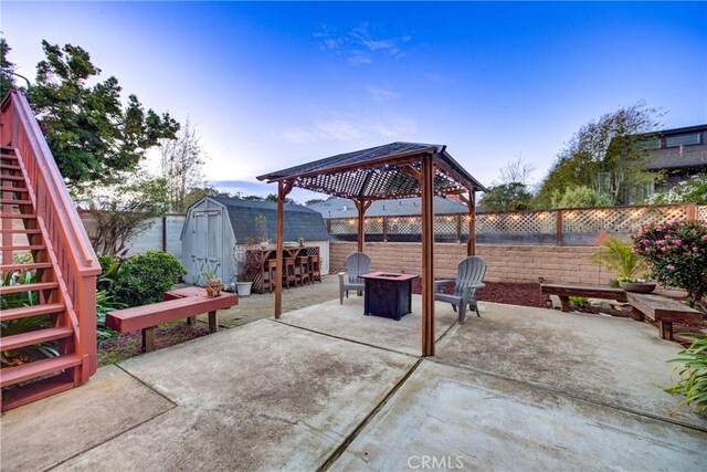 332 Grove St, Los Osos, CA 93402 - fenced backyard featuring a gazebo, a storage unit, an outdoor fire pit, a patio, and stairway