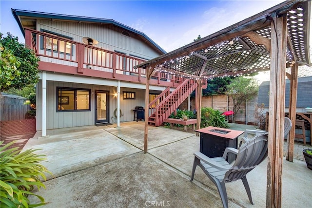 view of patio featuring an outdoor fire pit, a grill, fence, and a pergola