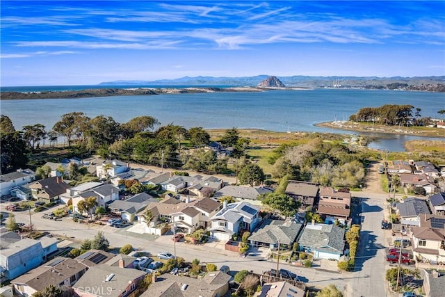 aerial view featuring a residential view and a water and mountain view