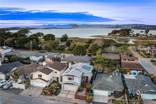 aerial view with a residential view and a water and mountain view