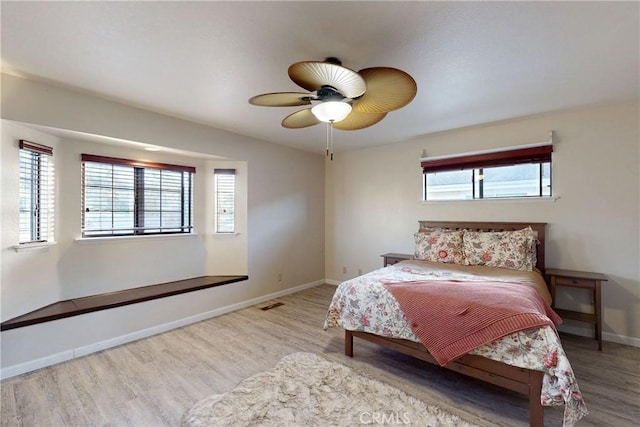 332 Grove St, Los Osos, CA 93402 - bedroom with wood finished floors, multiple windows, and ceiling fan