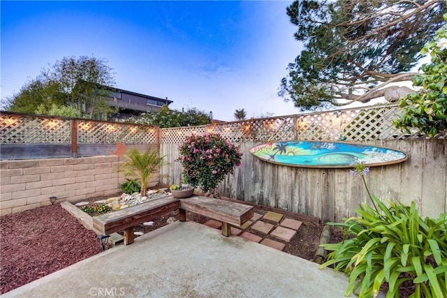 view of patio featuring a fenced backyard and a fenced in pool