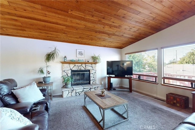 living room featuring vaulted ceiling, wooden ceiling, a fireplace, and baseboards