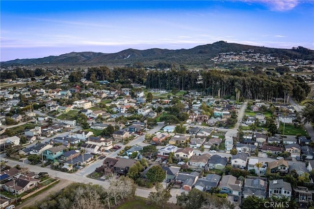 drone / aerial view featuring a residential view and a mountain view